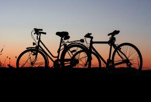 2 bicycles parked during sunset