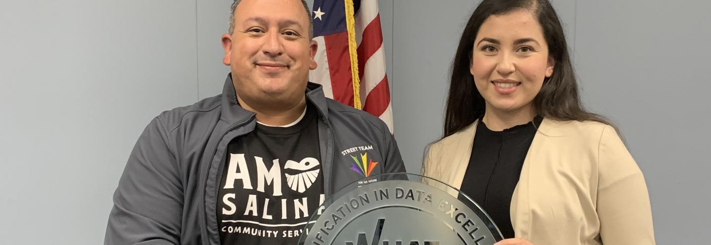 CASP Jose Arreola and Karina Silva holding the Salinas' What Works Cities Award 2021